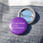 Preview: Ansteckbutton I understand only railstation auf Jeans mit Rückseite